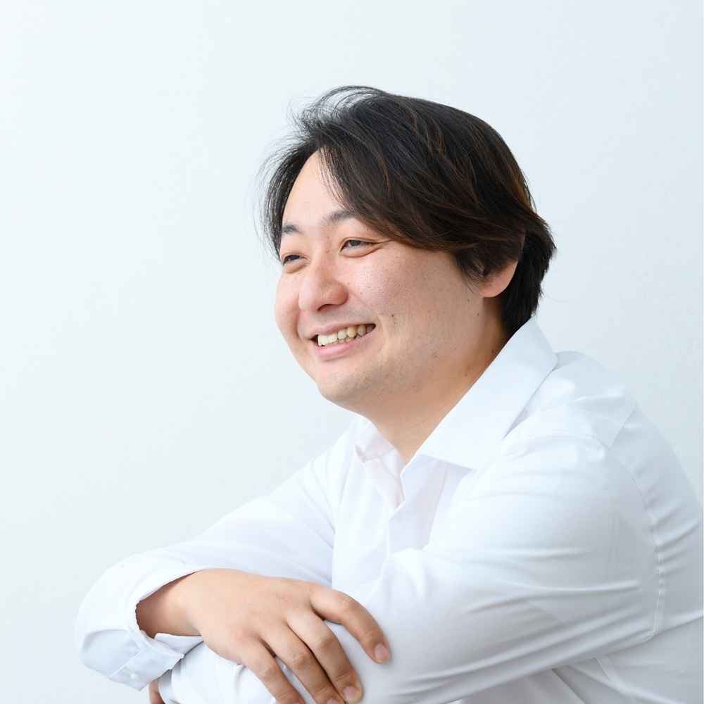 曲尾 健一